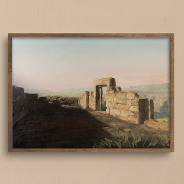 Framed artwork of a landscape with the ruins of an ancient synagogue, where sunlight spills over stone