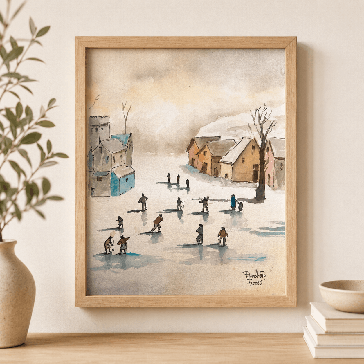 Framed artwork of a winter scene with people skating on a pond, displayed on a wall.
