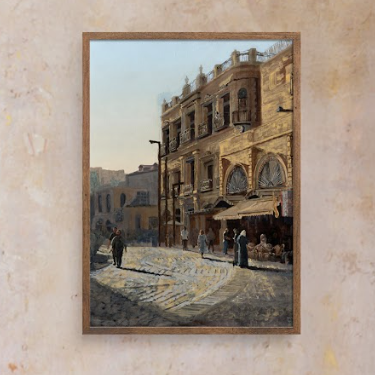 Framed painting of a city street scene on a beige wall. Old city Jerusalem oil painting