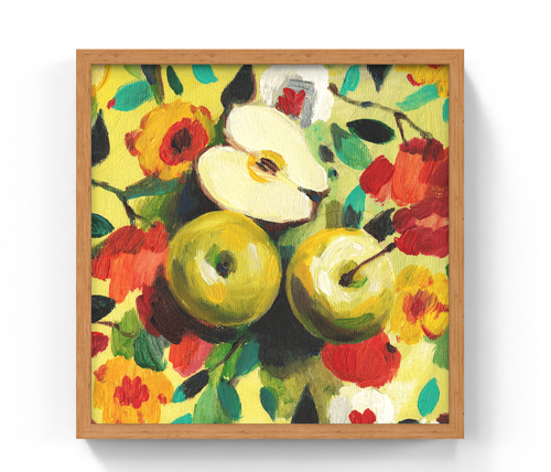 A framed still life painting of green apples and red flowers on a yellow background, shown in a light wood frame against a white wall.