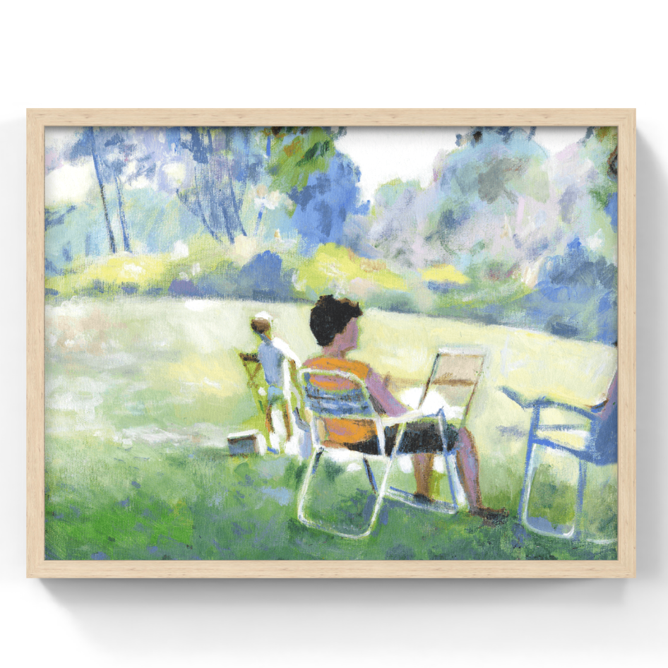 A framed impressionist-style painting depicting a person sitting in a lawn chair, another person in the background, and trees and grass in a park. The artwork is shown in a light natural wood frame against a white wall.