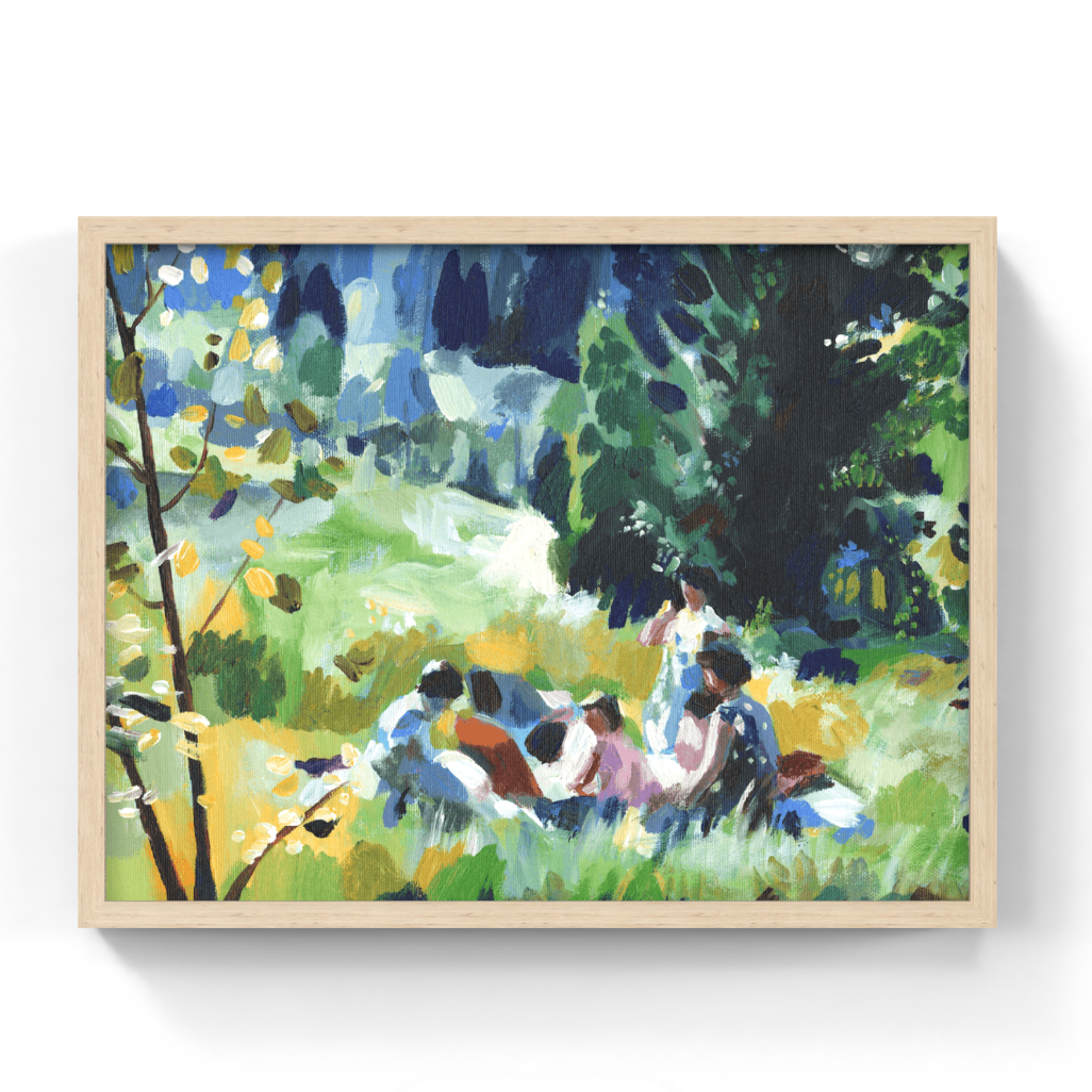 A framed impressionist painting depicting a group of people sitting in a grassy outdoor scene with trees and blue sky, presented in a light wood frame against a white background.