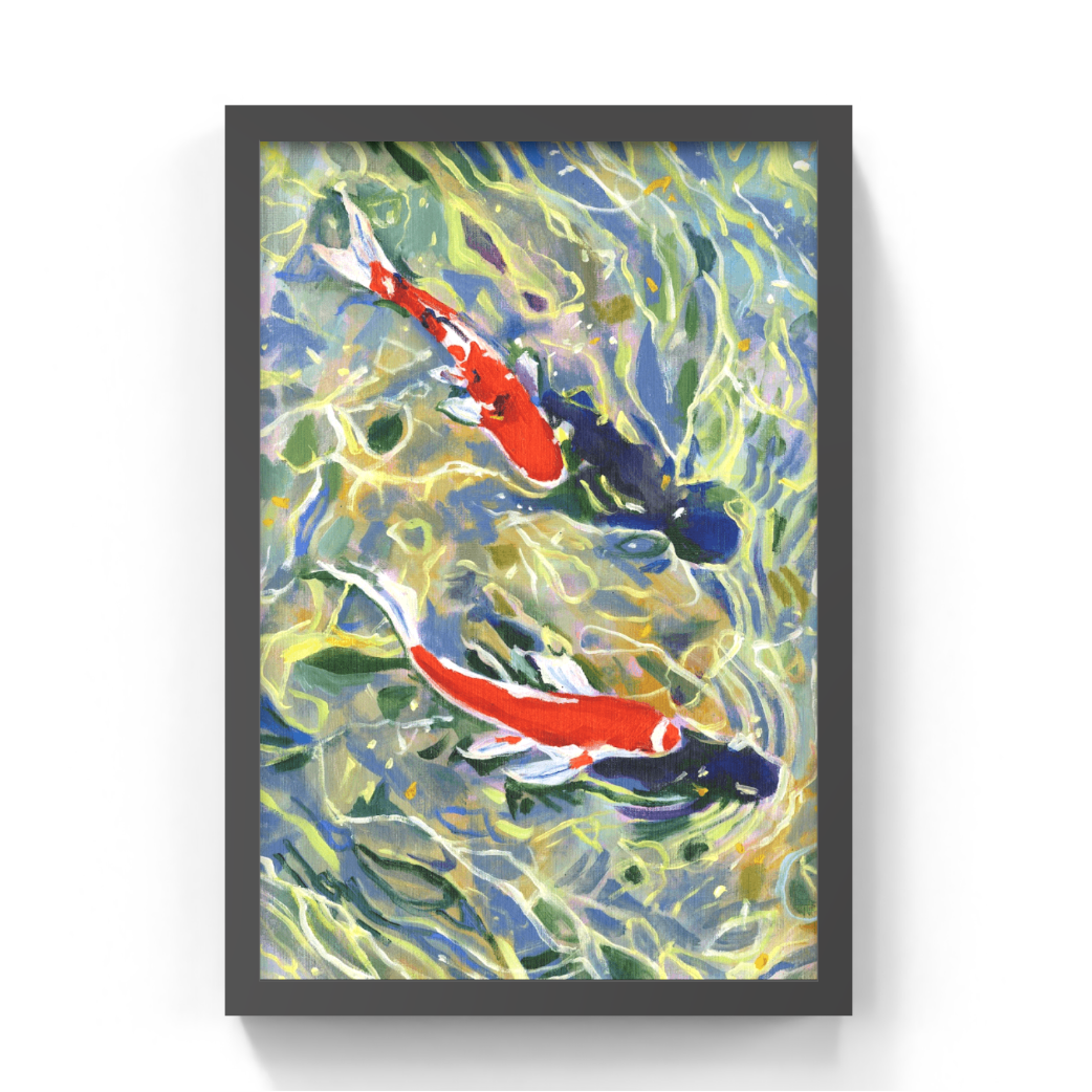 A framed art print depicting two koi fish swimming in rippling water, presented in a black frame against a white background.