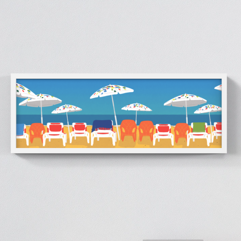 Framed artwork of the Tel Aviv beach scene with chairs and umbrellas on a white wall.