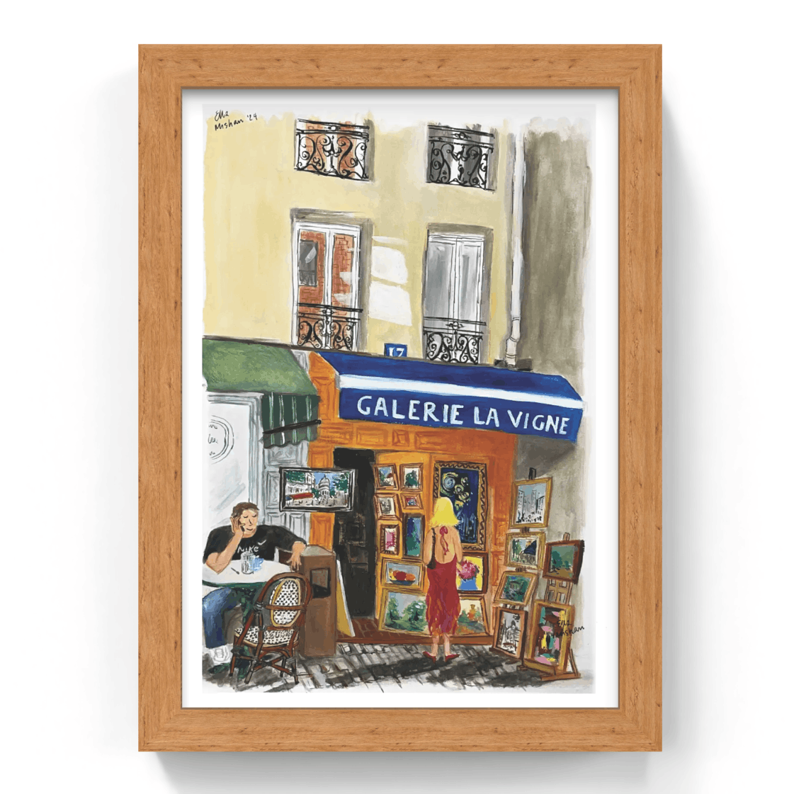 Framed artwork of a street scene with 'Galerie La Vigne' and people in front